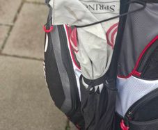 2 golf bags and various  club also jackets balls and tees shoes  and a trolly