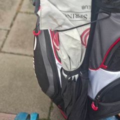 2 golf bags and various  club also jackets balls and tees shoes  and a trolly