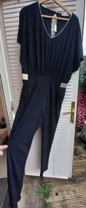 Navy jumpsuit with gold trim waist