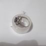 a silver dress ring with 10 white stones and purple stone Image 4