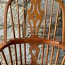 A large oak Windsor armchair. Image 6