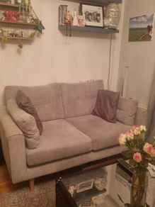 Light grey 2 seater sofe.