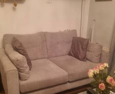 Light grey 2 seater sofe.