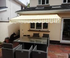 Awning 3x2m rain resistant yellow grey strips new in box .