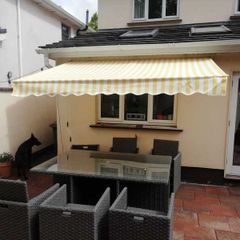 Awning 3x2m rain resistant yellow grey strips new in box .