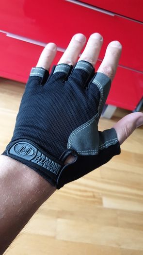 Gym gloves. Fingerless gloves. Cycling gloves. Work gloves. Carpenter gloves. Weightlifting. Workout.  Fitness.  Bodybuilding