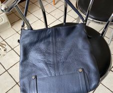 The White Stuff slouchy leather bag in smoky blue
