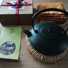 Japanese teapot with a stand and a bag