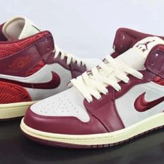 Air Jordan 1 Mid SE "Tiki Leaf" sneakers. The colorway is officially known as Team Red/University Red-Sail-Muslin Size 3