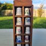 Collectible porcelain thimbles in a wall-mounted wooden display case Image 2