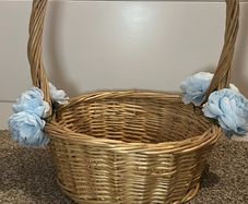 Wicker basket with artificial blue flowers.