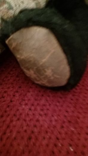 Antique straw-filled panda teddy bear