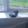 Concrete candle holder in the shape of a hand Image 2