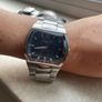 Kenneth Cole designer watch. Water Resistant. A few worn scratches but still working perfectly. Battery easily replaced and sits into the back of it. Image 4