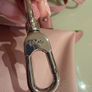 pink Longchamp Le Pliage mini top-handle bag with a detachable shoulder strap Image 9