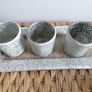 This mosaic glass set features three silver-crushed glass votive holders on a matching mirrored tray Image 2