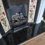 Fireplace in cast iron with wooden surround (painted white) and black marble hearth.   Perfect condition Image 2