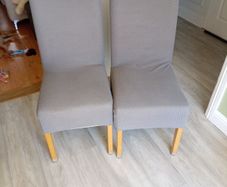 2 cream kitchen chairs with covers