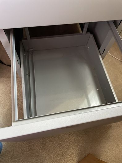 Grey lockable filing cabinet on castors