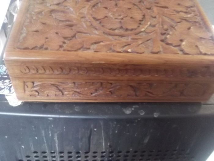 a antique carved wooden box