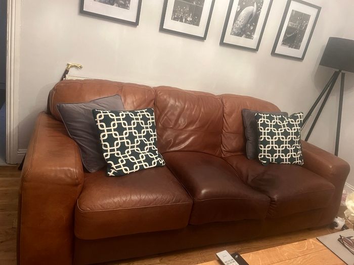 Three seater brown leather couch