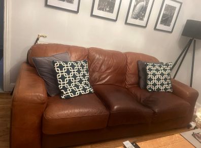 Three seater brown leather couch
