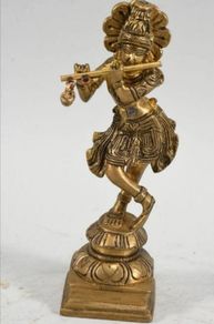 Heavy brass Deity with flute statue