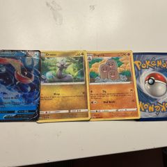Selection of Pokemon trading cards including Greninja V