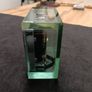 This is an Acctim Hamilton mantel clock made of glass and metal. Image 3
