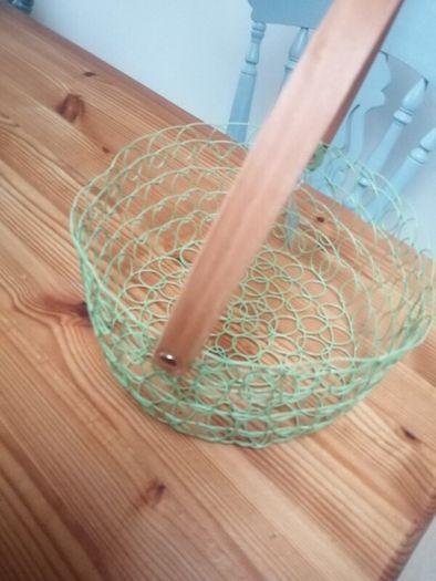New wire woven basket with wooden handle