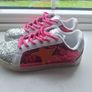 Brand new pink & silver glitter trainers with orange star detail Image 4