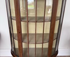 Bow fronted display cabinet