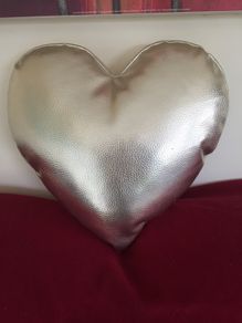 Heart shaped cushion. Gold colour.