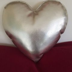 Heart shaped cushion. Gold colour.