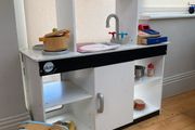 kids play kitchen by Plum with wooden food accessories