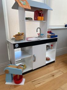 kids play kitchen by Plum with wooden food accessories