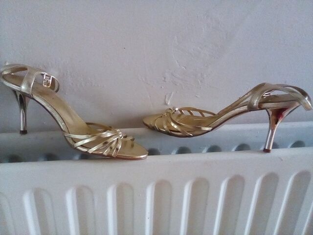 Gold strappy sandals/ shoes . Ideal for a wedding or night out . Size 6.In box
