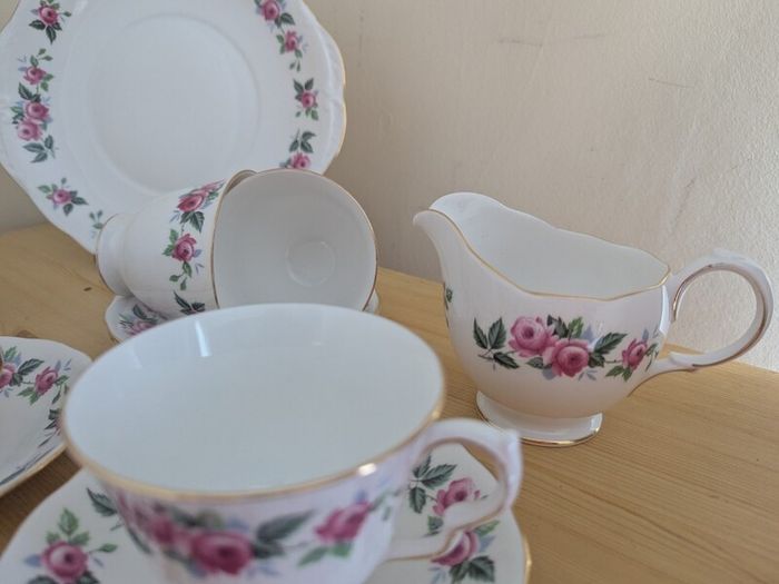 Queen Anne Bone China, tea set for 4 person, contains 11 pcs, including 4 tea cups, 4 saucers, a milk jar, a sugar bowl and a cookie serving plate 22cm. Impeccable conditions, looks like a new one, any scratches, cracks or cips.