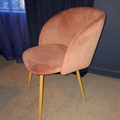 Plush pink velvet accent chair.