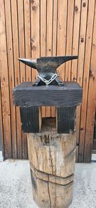 anvil on timber stand