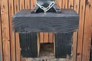 anvil on timber stand