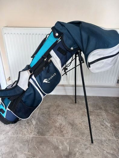 Junior golf clubs and bag with stand.