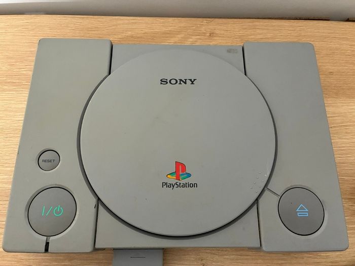 PlayStation console, Dual Shock controller, and all cables