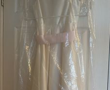 Marks and Spencer ivory dress with pink bow