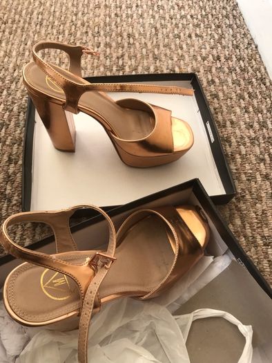 ladys shoes rose gold only wore once. Practically new.