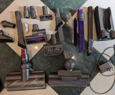 Two Dyson Vacuum Cleaners and accessories