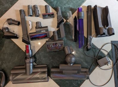Two Dyson Vacuum Cleaners and accessories