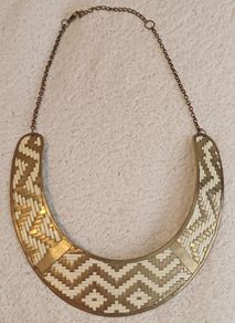 Gold metal torc style necklace