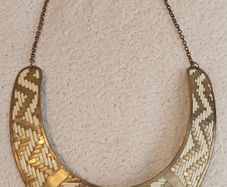 Gold metal torc style necklace