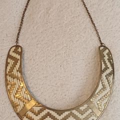 Gold metal torc style necklace